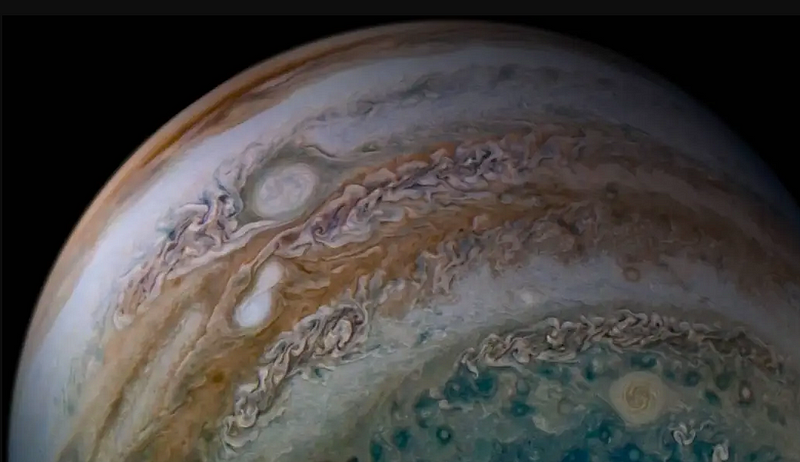 Merging storms on Jupiter as seen by the Juno spacecraft