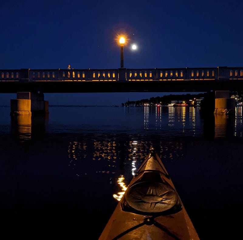 Nighttime reflections in harbor water